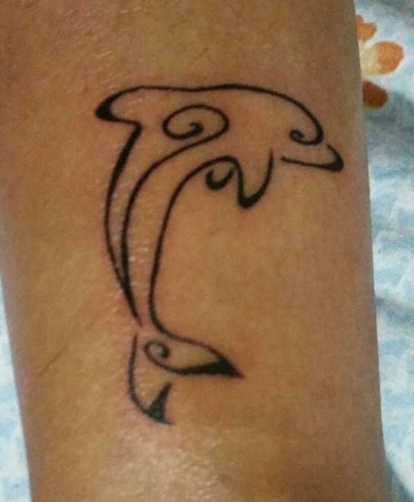 Enna  - stylized dolphin tattoo